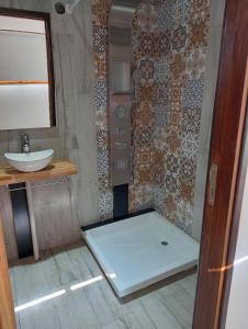 a small bathroom with a sink and a toilet at Destino Los Tachos in Mar del Plata