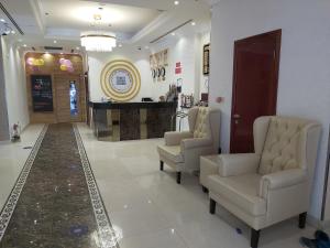 a waiting room with chairs and a barber shop at Bliss Hotel in Dubai