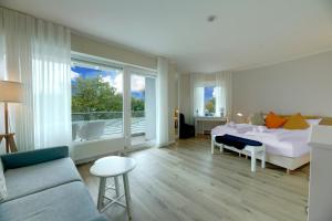 Postel nebo postele na pokoji v ubytování Hotel Seeliebe