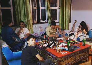 a group of people sitting around a table at Great Eastern Valley Residency in Gangtok