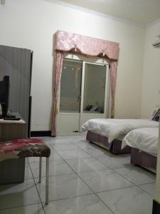 Letto o letti in una camera di 豪鵬遊民宿2館