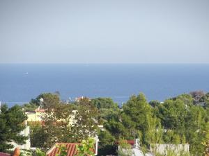 a view of the ocean from a house at Artemis GreenHill in Vravrona