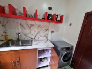 Η κουζίνα ή μικρή κουζίνα στο CG Apartments