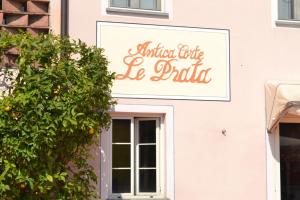 a sign on the side of a building at Corte Prata in Capannori