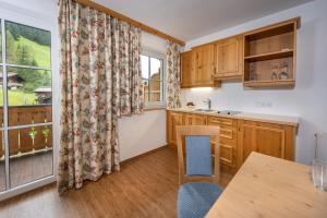 Cucina o angolo cottura di Naturhotel Hüttenwirt im Grossarltal