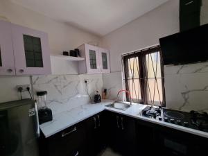 Kuchyň nebo kuchyňský kout v ubytování CG Apartments