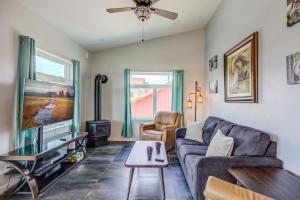 a living room with a couch and a tv at Castle in the Sky Unit Z in West Yellowstone