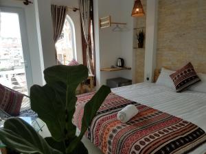 Postel nebo postele na pokoji v ubytování Hotel Làng Kò Hơ