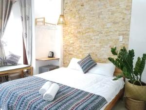 Postel nebo postele na pokoji v ubytování Hotel Làng Kò Hơ