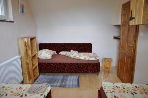 A bed or beds in a room at András penzión