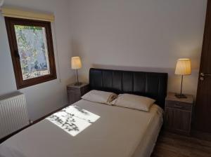 Postel nebo postele na pokoji v ubytování Roses Villa