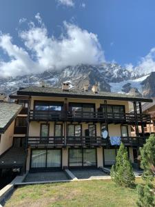 a large building with a mountain in the background at Stunning view in Breuil-Cervinia