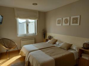A bed or beds in a room at Ultreia