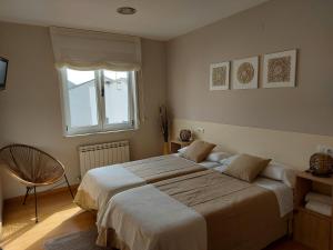 A bed or beds in a room at Ultreia