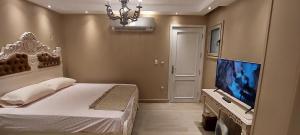 TV a/nebo společenská místnost v ubytování كمباوند جاليريا مون فالي