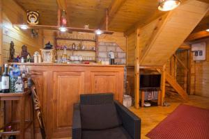 a room with a bar in a wooden cabin at Lovcen mountain cottages in Vratnica
