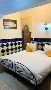 Postel nebo postele na pokoji v ubytování Riad Hôtel Belleville Marrakech