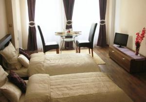 a living room with a couch and a table with chairs at Sleep Well in Poznań +22 photos