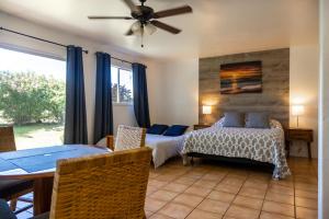 Кровать или кровати в номере Puu Koa Palms vacation rental