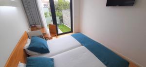Cama o camas de una habitación en Boavista Class Inn