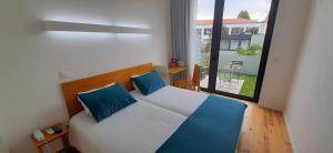 Cama o camas de una habitación en Boavista Class Inn