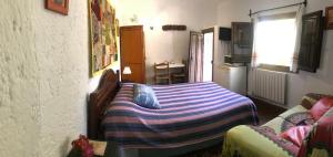A bed or beds in a room at "Casa Ibero" Bubion, Alojamiento Turistico Rural Még 37 kép