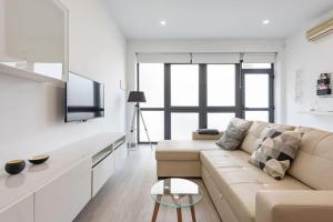 Televízia a/alebo spoločenská miestnosť v ubytovaní Charming loft B