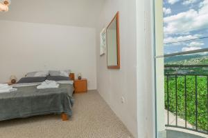 Postel nebo postele na pokoji v ubytování House Cattleya