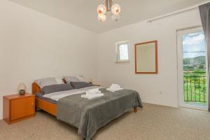 Postel nebo postele na pokoji v ubytování House Cattleya