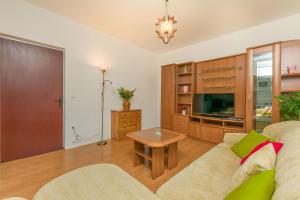 TV a/nebo společenská místnost v ubytování House Cattleya