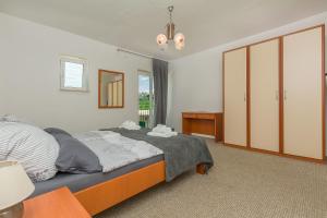 Postel nebo postele na pokoji v ubytování House Cattleya