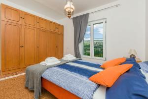Postel nebo postele na pokoji v ubytování House Cattleya