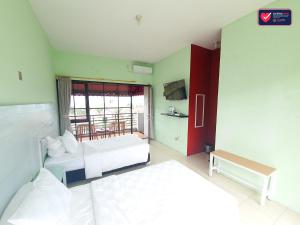Letto o letti in una camera di Hotel Griya Wijaya