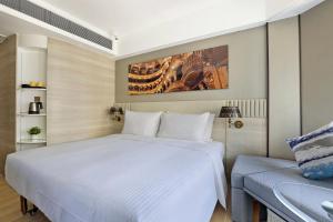 Giường trong phòng chung tại Hotel Alexandra