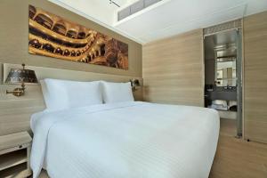 Giường trong phòng chung tại Hotel Alexandra