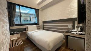 En eller flere senger på et rom på Weifeng Boutique Business Hotel - Zhanqian Branch
