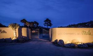 a gate at the entrance to the los angeles chinese museum at night at Hotel Les Chambres de Mila Bonifacio in Bonifacio