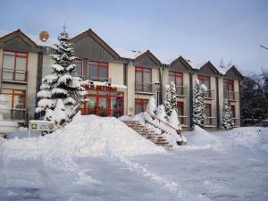 a building with a pile of snow in front of it at Landhotel Stüer in Altenberge