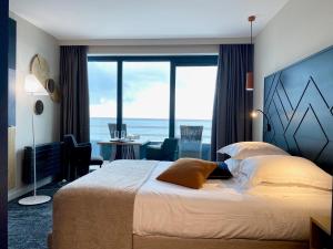 Кровать или кровати в номере Hotel Atlantic