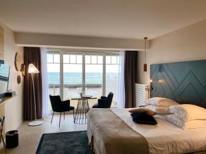 Кровать или кровати в номере Hotel Atlantic