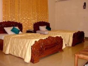 Ein Bett oder Betten in einem Zimmer der Unterkunft Star Hotel