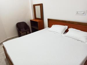 Letto o letti in una camera di Natraj Homes