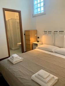 Cama ou camas em um quarto em R 75 centro storico
