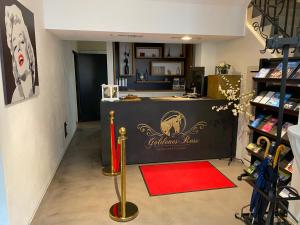 a room with a table with a red carpet at Hotel Restaurant Goldenes Ross in Göllheim
