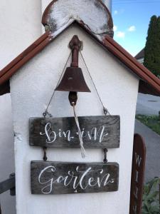 a house with a bell on the side of it at Bed & Breakfast Chez Lips in Oberbildein