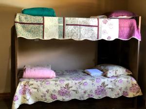 Postel nebo postele na pokoji v ubytování Pousada Camping e Restaurante Vila dos Arcanjos