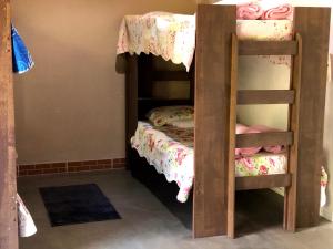 Postel nebo postele na pokoji v ubytování Pousada Camping e Restaurante Vila dos Arcanjos