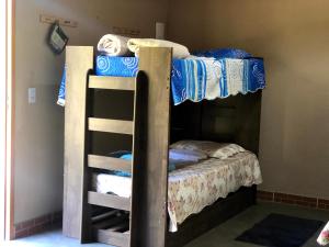 Postel nebo postele na pokoji v ubytování Pousada Camping e Restaurante Vila dos Arcanjos