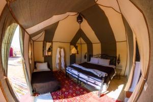 Giường trong phòng chung tại Asama Luxury Camp