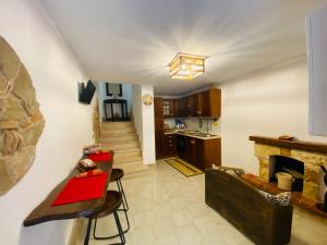 a living room with a couch and a fireplace at Casa vacanze Da Mammanonna in Taurasi